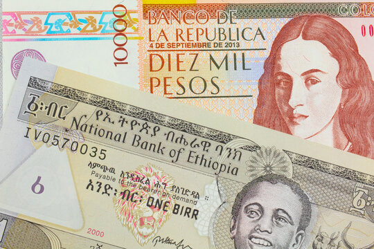 A macro image of a brown ten thousand bank note from Colombia paired up with a grey Ethiopian one birr bill.  Shot close up in macro.