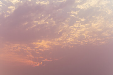 Low Angle View Of Sky At Sunset with small sun