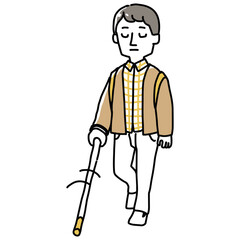 白杖で探りながら歩く視覚障害者