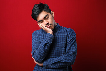Young asian man wearing casual shirt thinking looking tired and bored with depression problems with crossed arms.