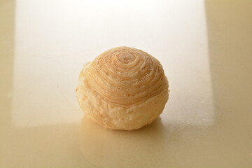 baked round crispy purple yam taro with sweet potato pumpkin sweet paste and egg yolk teochew mooncake on marble table lantern mid autumn festival chinese halal pastry product menu