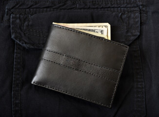 Leather wallet with cash sticking out