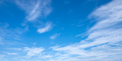 Naklejka na ściany i meble Blurred white clouds on the sky background.