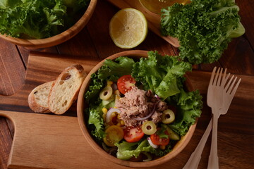 Tuna Fish Salad with Lettuce, Cherry Tomatoes, Cucumber, onions and Corn, and olives
