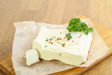 Greek Feta cheese over board