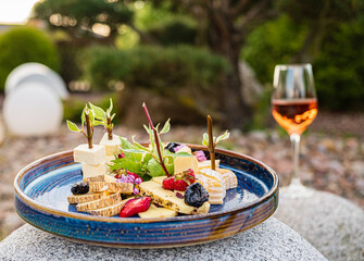 cheese plate with nuts and fruits