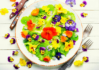 Edible flower salad in the plate