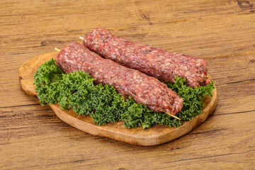 Raw minced beef kebab skewer