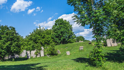 Ukraine, Busk - june, 2021: Old headstones (grave markers, tombstones, matzevot) at The Old Jewish Cemetery of Busk. 
