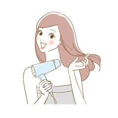 ドライヤーで髪を乾かす女性