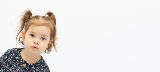 portrait of two years old sad blond girl banner with copy space
