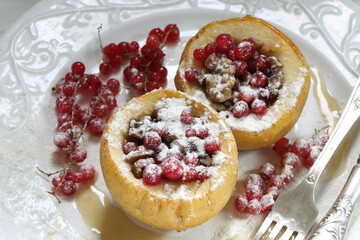 aked apples stuffed with berries in powdered sugar