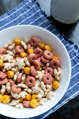 Colored cereals in a white bowl