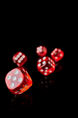 red and white craps or dices on reflective black background