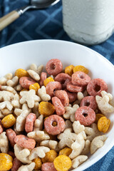 Colored cereals in a white bowl