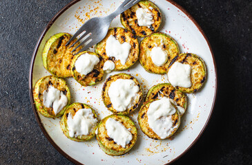 grilled zucchini fried vegetables on the table, healthy food meal snack copy space food background rustic. top view keto or paleo diet veggie vegan or vegetarian food