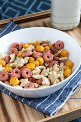 Colored cereals in a white bowl