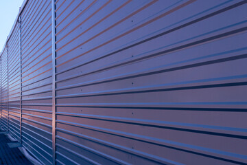 Trapezoidal sheet placed on the facade of the warehouse. Perspective view.