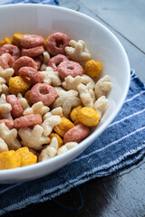 Colored cereals in a white bowl