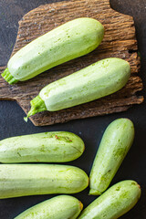 zucchini fresh vegetables Cooking harvest organic farm products on the table, healthy food meal copy space food background rustic. top view keto or paleo diet veggie vegan or vegetarian