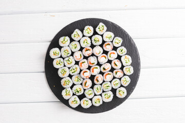Sushi rolls on black board