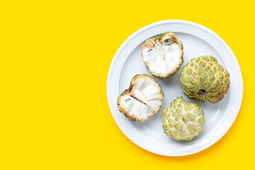 Custard apple on yellow background.