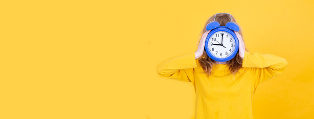 woman with alarm clock in hands isolated