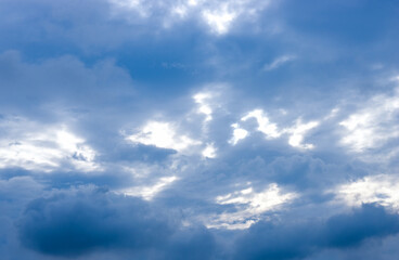 Dark blue clouds under the sunny sky before rain