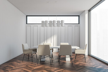 White meeting room with table on dark brown parquet