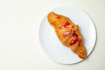 Croissants with strawberries and chocolate. High quality photo