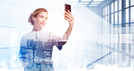 Businesswoman using smartphone, to communicate with business colleagues on the distance or checking worlds news in the internet, double exposure. Modern panoramic office with skyscraper city view