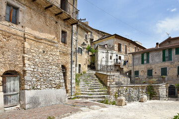 Fototapeta na wymiar A small street among the old houses of Arce, a medieval village in the Lazio region in Italy.