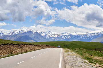 the road between the mountains . Caucasus. snowy peaks