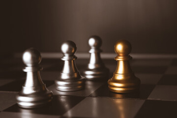 Closeup of chess characters on board games. to represent decision making in term of business strategy to find out the best solution to meet target objective and goal.	
