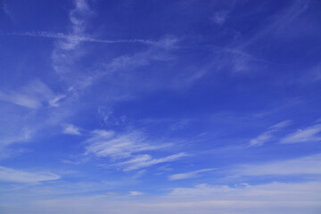 Light cirrus clouds in the blue sky