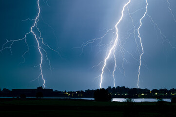 Branched lightning strikes close to a river