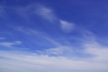 Light cirrus clouds in the blue sky
