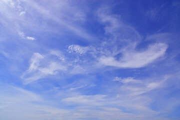Light cirrus clouds in the blue sky
