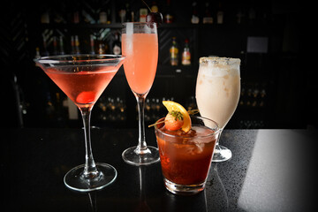 bartender make special cold cocktail or mocktail in tall glass goblet on black background luxury hotel pub iced beverage menu