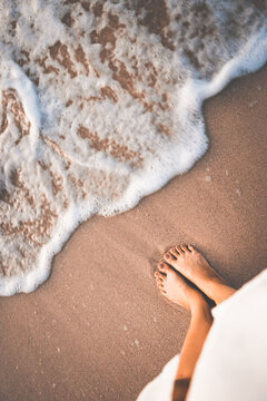 Traveler woman foot relax on beach