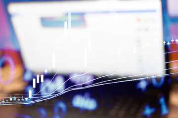 Abstract financial trading graphs and digital number of foreign exchange market trading on monitor. Background of gold and blue digital chart to represent stock market trend.	
