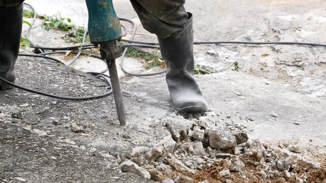 Building demolition jack hammer drill breaking concrete,slow motion