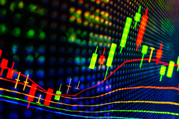 Abstract financial trading graphs and digital number of foreign exchange market trading on monitor. Background of gold and blue digital chart to represent stock market trend.	
