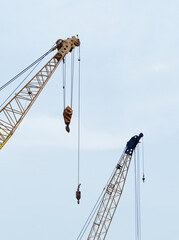 Naklejka premium Construction cranes located in the construction site area