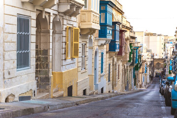 Traditional Maltese colorful wooden balconies in Sliema, Malta