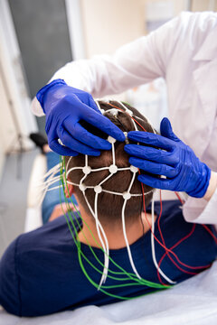 Patient brain testing using encephalography at medical center