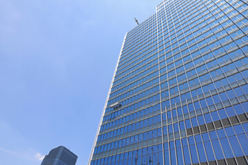 Obraz na płótnie Canvas 高層ビルの窓ガラス清掃
