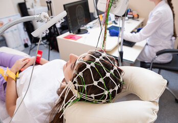 Patient brain testing using encephalography at medical center