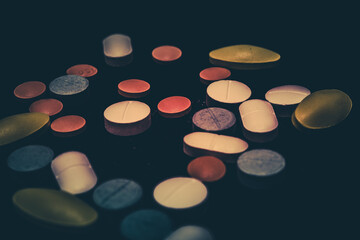 Pharmaceutical medicine pills in both tablets and capsules with the vintage retro picture style. Pharmacy theme and treatment medication as concept.	
