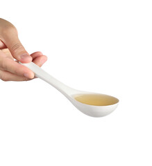 Hand holding noodle soup in spoon on white background, Soup for sukiyaki from chicken and fish